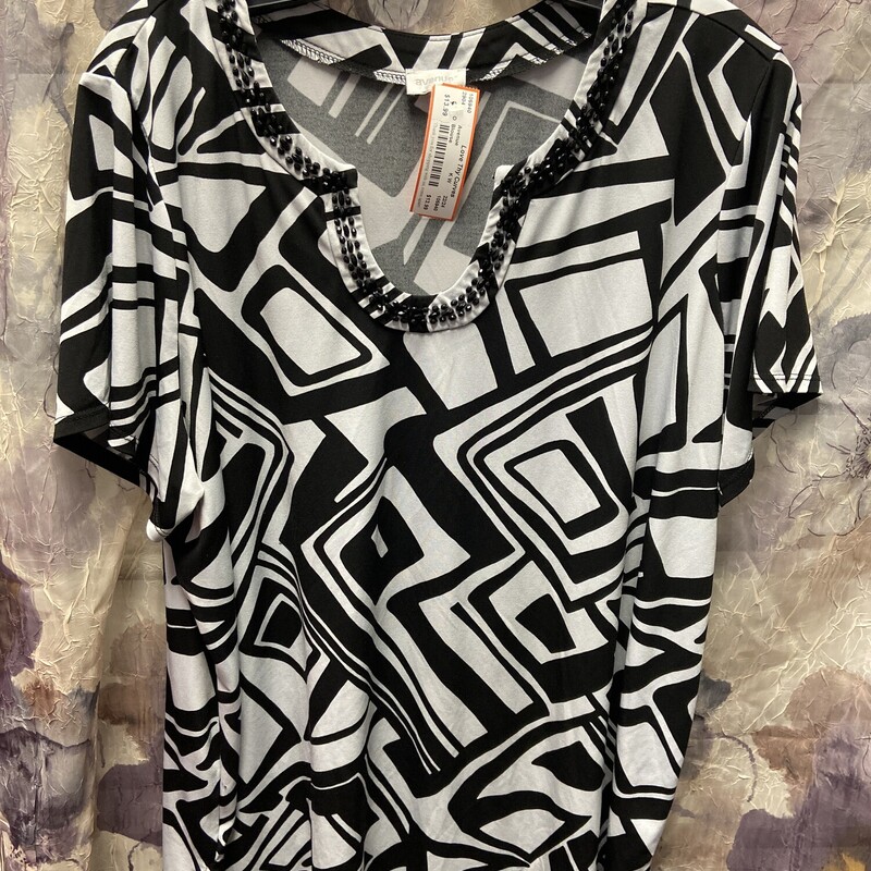 Short sleeve blouse in black and white print with black beading along the neckline.