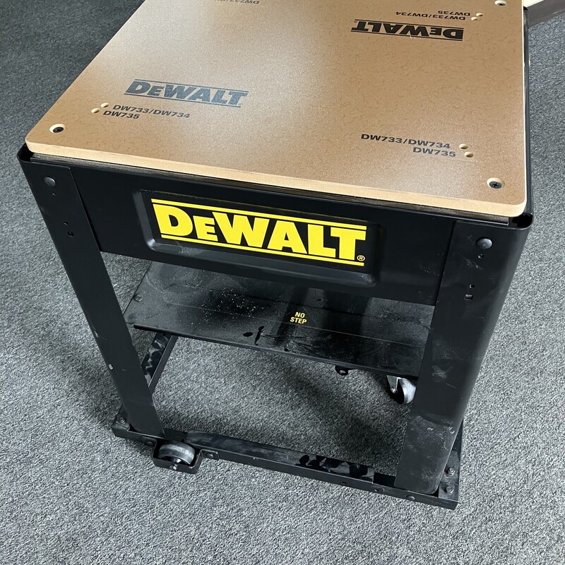 Planer Stand, DeWalt

DeWalt DW7350 Planer Stand with Integral Mobile Base


Built from tough, heavy gauge steel brackets, the DW7350 Planer Stand from DeWalt is capable of supporting even the heaviest benchtop planers. Its medium-density fiberboard top is predrilled for easy installation of any DeWalt planer, and can be easily drilled for other planers as well. Best of all, mobility comes built-in with the integral mobile case and casters. Simply use the foot pedal to lower the stand firmly to the ground, or raise it up to be rolled away.


Features:

Durable and stable even under heavy loads
Easy mobility for compact storage and working on the jobsite
Includes mobile base, stand, hardware, MDF top and metal shelf
Measures approximately 21''W x 27''L x 29-1/2''H