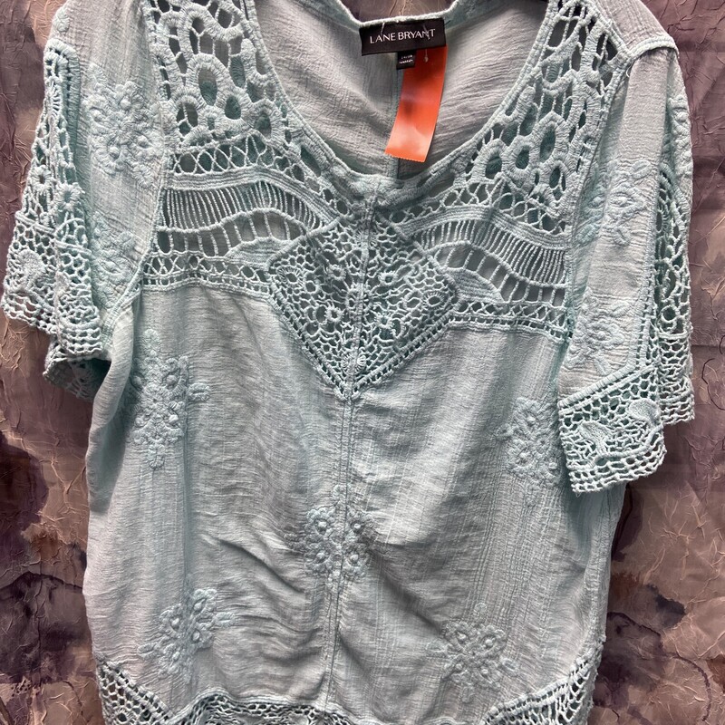 Short sleeve blouse in a soft teal with macrame embellishments
