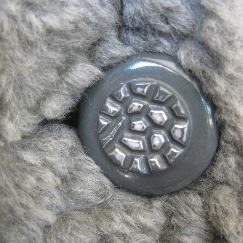 Vtg Faux P. Lamb, Gray, Size: Small<br />
Nice faux persian lamb coat in gray.  It's has a Faux shearling collar and facings.<br />
It good vintage condition.  Not perfect<br />
It could use a new lining<br />
The faux fur is a little rough to the touch.<br />
Make sure it fits you and it will be comfortable and fun to wear.<br />
And Warm.<br />
Union label and a 60s style brand/store label<br />
Fancy buttons, and an extra one on the inside.<br />
pockets<br />
<br />
flat measurements:<br />
armpit to armpit:  20.5  (taken on the inside of the coat)<br />
length: 32 , will probably hit above your kneed<br />
waist area: 23<br />
hip area: 24<br />
underarm sleeve seam length: 14.5, this is a 'bracelet' length, designed to show off longer gloves and arm candy<br />
<br />
thanks for looking!<br />
#70403