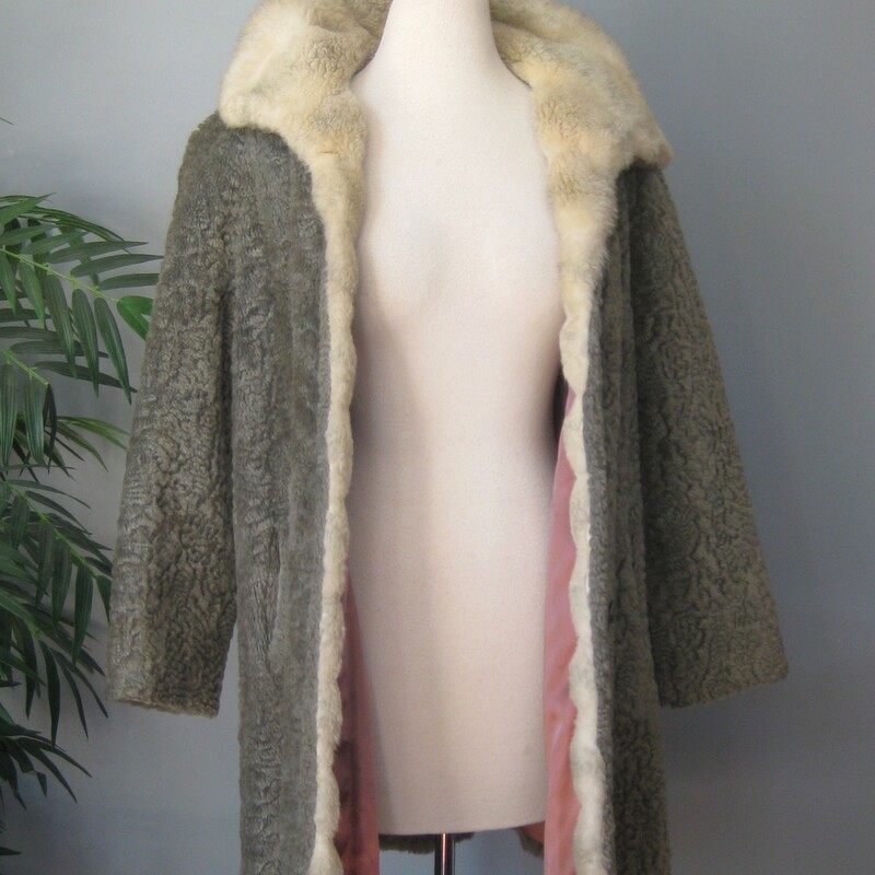 Vtg Faux P. Lamb, Gray, Size: Small<br />
Nice faux persian lamb coat in gray.  It's has a Faux shearling collar and facings.<br />
It good vintage condition.  Not perfect<br />
It could use a new lining<br />
The faux fur is a little rough to the touch.<br />
Make sure it fits you and it will be comfortable and fun to wear.<br />
And Warm.<br />
Union label and a 60s style brand/store label<br />
Fancy buttons, and an extra one on the inside.<br />
pockets<br />
<br />
flat measurements:<br />
armpit to armpit:  20.5  (taken on the inside of the coat)<br />
length: 32 , will probably hit above your kneed<br />
waist area: 23<br />
hip area: 24<br />
underarm sleeve seam length: 14.5, this is a 'bracelet' length, designed to show off longer gloves and arm candy<br />
<br />
thanks for looking!<br />
#70403