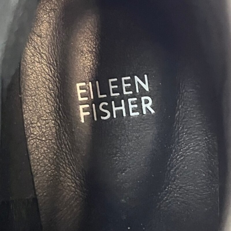 Eileen Fisher The Chelsea Boot<br />
<br />
Redefined by a chunky wedge heel and lugged sole. A modern take on a classic in sleek patent leather.<br />
<br />
1-inch heel, 1/2-inch platform. 4-inch shaft height.<br />
Elastic panels at side and back, lug sole.<br />
Color: Black<br />
Size: 11