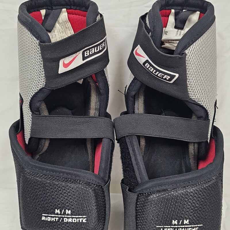 Nike Bauer Supreme 10 Elbow Pads<br />
Size: Senior Medium<br />
Pre-Owned: Excellent Condition<br />
No rips, tears, or signs of wear.  Elastic straps are in excellent condition w/ no signs of being overstretched.  Velcro is in excellent working order.