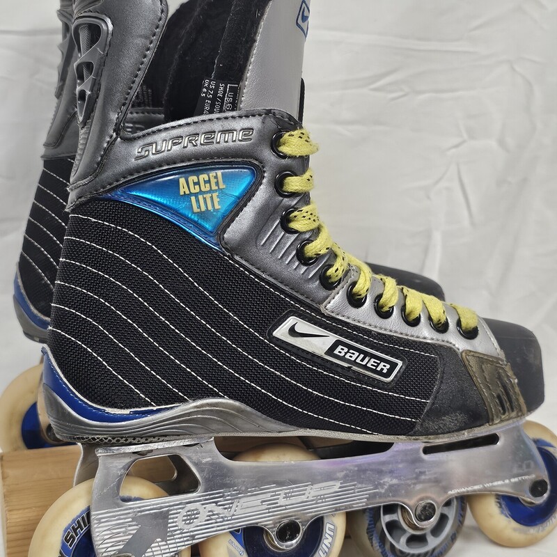 Bauer Supreme Accel-Lite Inline Roller Hockey Skates<br />
Size 6 Fit R<br />
Tuuk One Up Wheel Chassis<br />
7676 7272 Wheel pattern<br />
Pre-Owned: Excellent Condition<br />
Boot is in excellent shape.  No rips or tears on inner lining.  Only a couple minor scuffs on outside of boot.<br />
Wheel Chassis are in excellent condition.<br />
Bearing are in very good condition. All roll freely.<br />
Wheels are in very good condition. Slight angle from normal use. Lots of rubber left