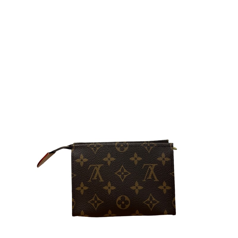 LOUIS VUITTON Monogram Toiletry Pouch 15. This cosmetics pouch is crafted of classic Louis Vuitton monogram coated canvas in brown. The pouch features a gold top zipper that opens to a dark pink leather-like interior.
Dimensions:

Length: 5.75 in
Height: 4 in
Width: 2 in