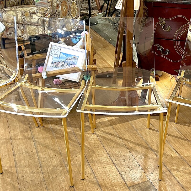 Set of 4 CB2 clear chairs with gold legs