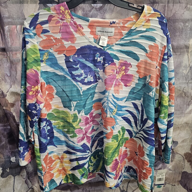 Half sleeve ribbed knit top in a bold floral print.