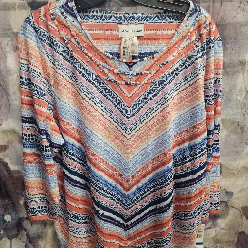 Half sleeve and light weight knit top in a multi colored print.