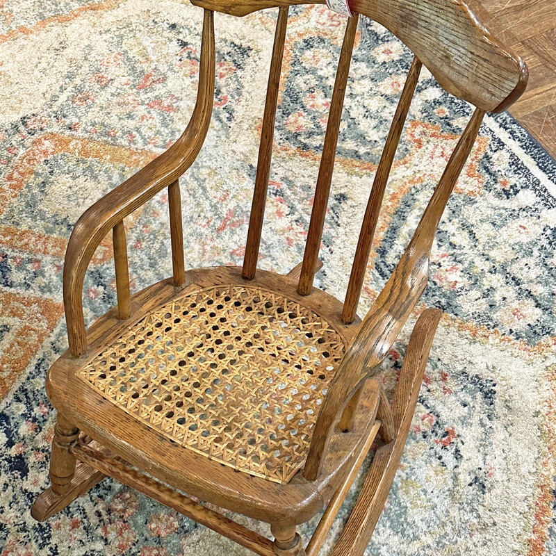 Vintage Oak Child's Caned Seated Rocker
15 In Wide x 21 In Deep x 23 In Tall.
