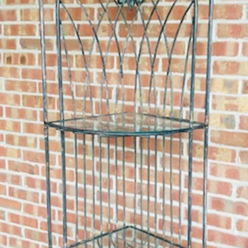 Iron and Glass Fleur De Lis Corner Shelf
Silver Brown Green Clear Size: 22.5 x 17 x 80H
3 removable glass shelves
Does not fold or come apart
Matching shelf sold separately