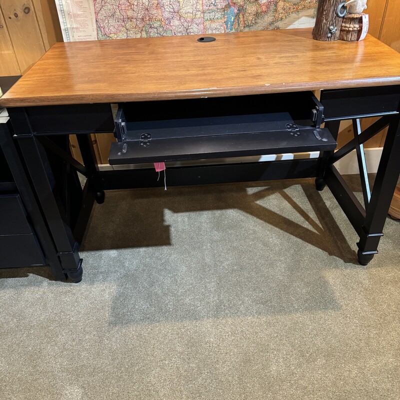 Computer Desk Black with Brown Wood Top.
Has a Keyboard Drawer and Cord Access Through Top
47 Inches Wide, 23 Inches Deep, 30 Inches High