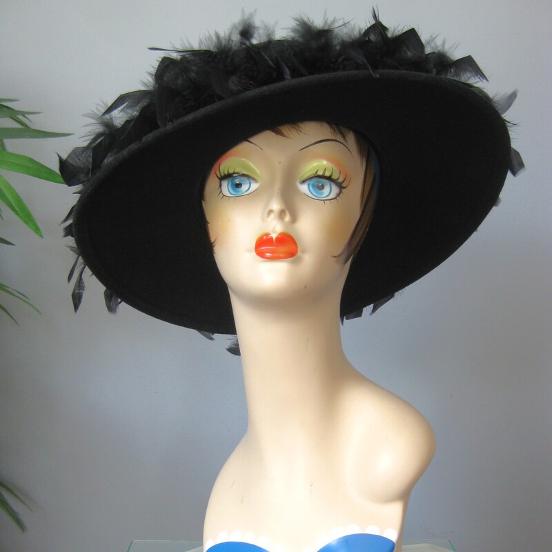 Vtg Belmart W Feathers, Black, Size: None<br />
This black feathered hat has a short crown and deep brim covered with black feathers.<br />
It's by Betmar and I believe it's from the 60s<br />
So Chic, dramatic and fun.<br />
The feathers are all firmly attached and beautifully glossy.  The inner hat band measures 21.5 around.<br />
Excellent condition, no flaws.<br />
thanks for looking<br />
#75020