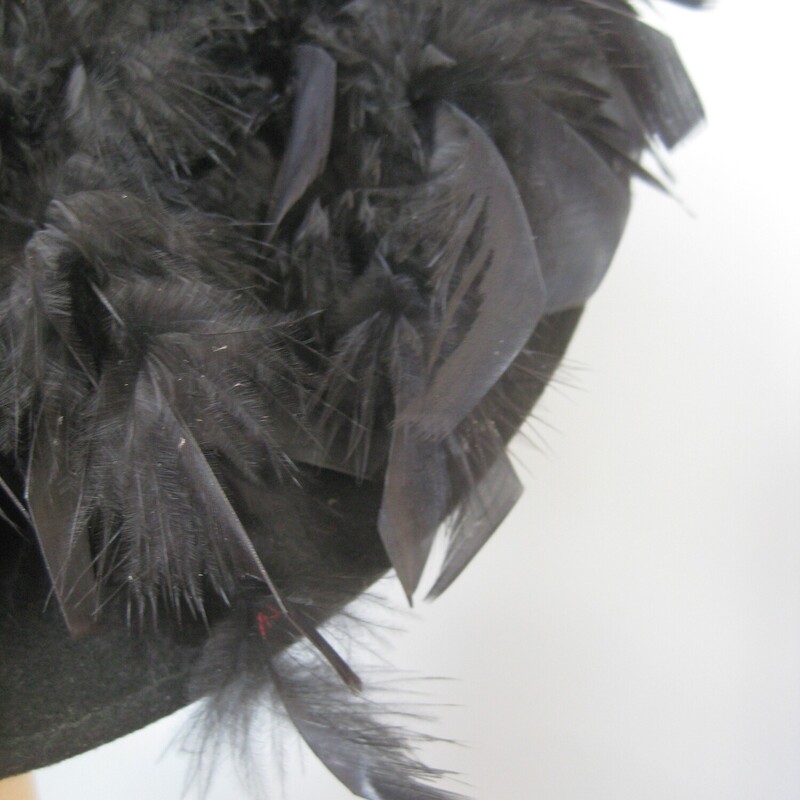 Vtg Belmart W Feathers, Black, Size: None<br />
This black feathered hat has a short crown and deep brim covered with black feathers.<br />
It's by Betmar and I believe it's from the 60s<br />
So Chic, dramatic and fun.<br />
The feathers are all firmly attached and beautifully glossy.  The inner hat band measures 21.5 around.<br />
Excellent condition, no flaws.<br />
thanks for looking<br />
#75020