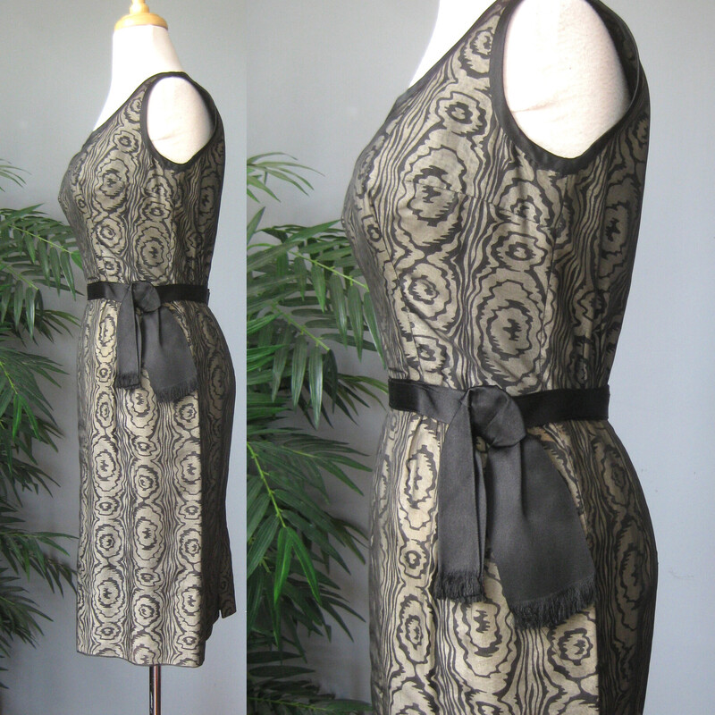 Vtg 50s Silk Print, Blk/gray, Size: Small<br />
Sophisticated cocktail dress from the 1950s.  This is a custom handmade dress.<br />
It was made from a black and white abstract swirl print cotton or cotton silk blend overlain with sheer black organza.  Fitted and offering high end dressmaker details like a waist and bra bra stays and bound armholes.  It also has a deep hem, 4 1/8, this deep hem provides stability and a bit of weight at the bottom, not that this dress is liable to fly up in any wind, it's too fitted for that!<br />
<br />
Center back black metal zipper.<br />
beautifully fringed attached satin belt.<br />
<br />
This dress fits my size 4 mannequin perfectly but without a lot of room to spare.<br />
Here are the flat meausurements:<br />
armpit to armpit: 18.5<br />
waist: 13<br />
hip: 18.75<br />
length: 38<br />
<br />
Excellent condition, no flaws.<br />
thanks for looking!<br />
#70432