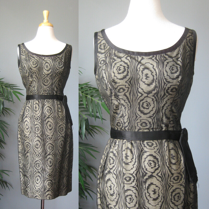 Vtg 50s Silk Print, Blk/gray, Size: Small
Sophisticated cocktail dress from the 1950s.  This is a custom handmade dress.
It was made from a black and white abstract swirl print cotton or cotton silk blend overlain with sheer black organza.  Fitted and offering high end dressmaker details like a waist and bra bra stays and bound armholes.  It also has a deep hem, 4 1/8, this deep hem provides stability and a bit of weight at the bottom, not that this dress is liable to fly up in any wind, it's too fitted for that!

Center back black metal zipper.
beautifully fringed attached satin belt.

This dress fits my size 4 mannequin perfectly but without a lot of room to spare.
Here are the flat meausurements:
armpit to armpit: 18.5
waist: 13
hip: 18.75
length: 38

Excellent condition, no flaws.
thanks for looking!
#70432