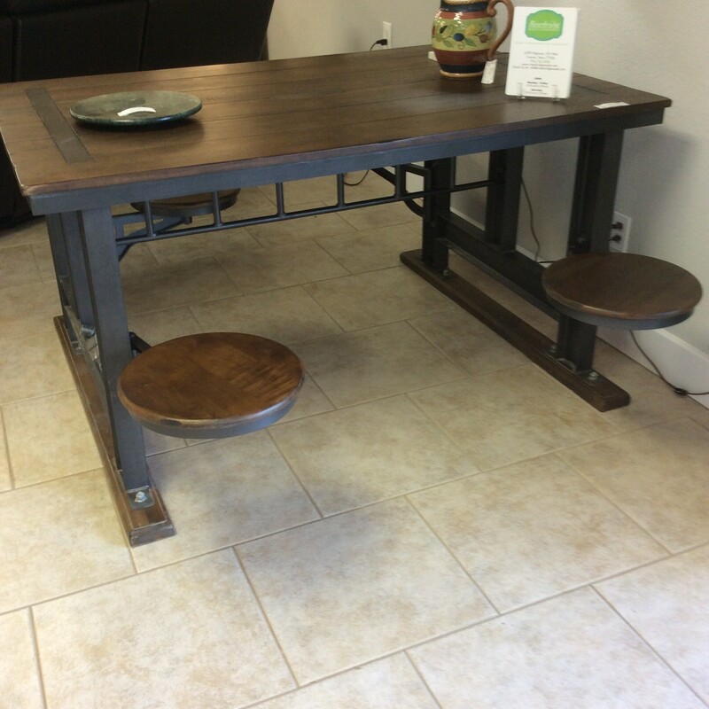 Industrial dining table and stool set is made with teak and metal.  With four attached seats are collapsible Size: 60x40x32