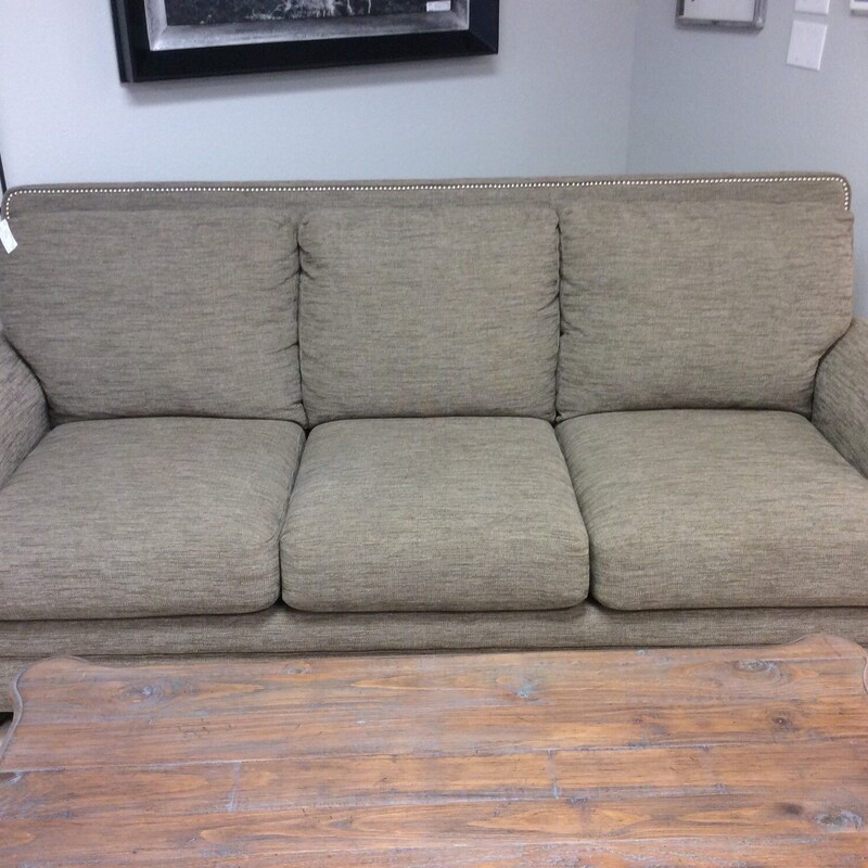This is a very nice sofa from Lazboy! Traditional in style,
in comes with the rolled arms and a bold nailhead trim. Back cushions are attached and it's in very good condition. It would make a great napper too!