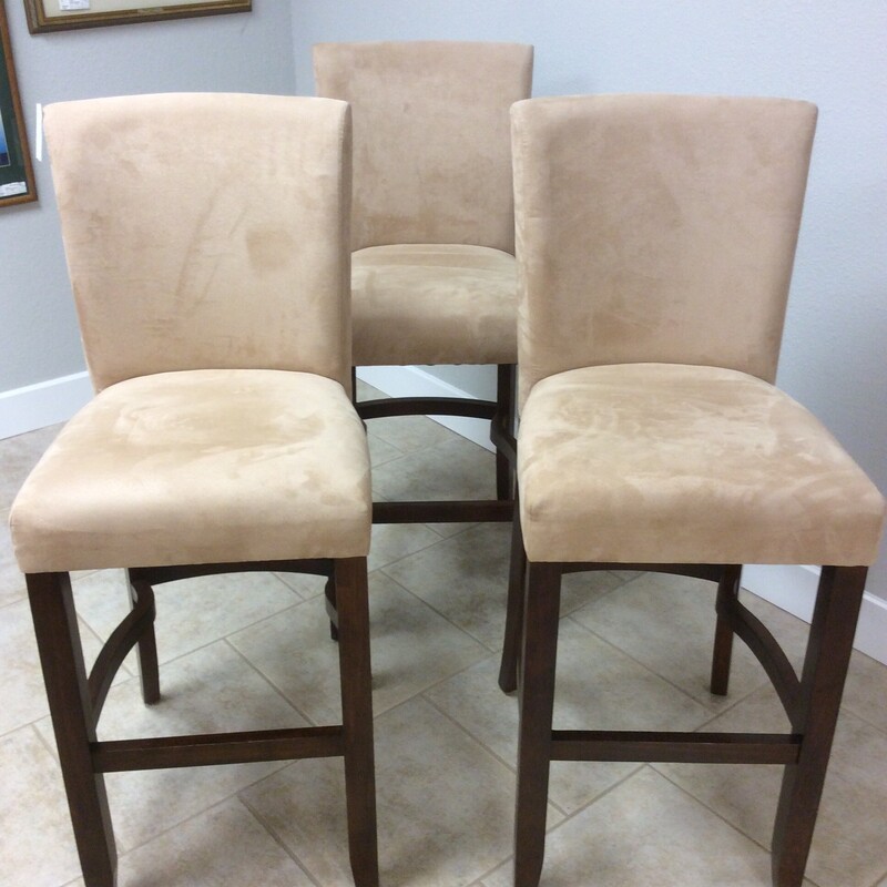 This is a very nice set of 3 barstools. Modern in design, they've been upholstered in a tan microsuede that is as soft as butta'. Thery're in  good condition too.