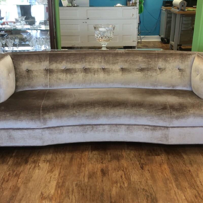 Pair of velour Taupe colored Sofas,  Dumont has a welcoming curve that encourages you to turn toward each other.  Welt around arms and base outlines the sculpted shape. Size: 91