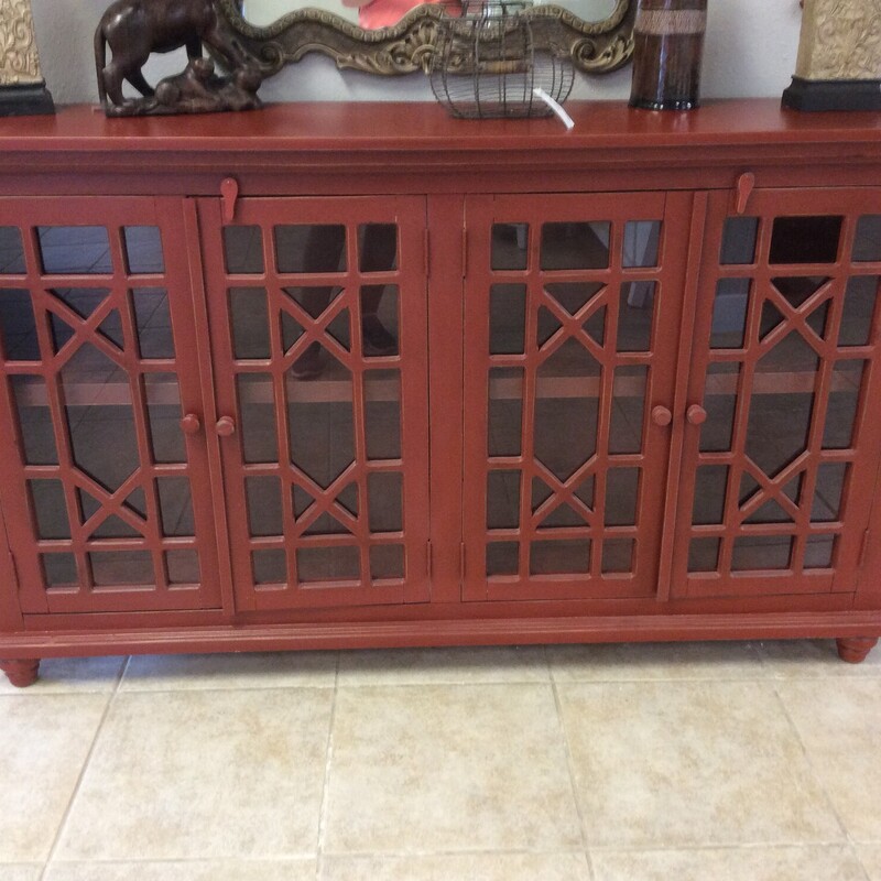 This unique piece will add a splash of color to your room! It could be used as a curio cabinet or as a media cabinet. It features interior lighting, an interior shelf and has been painted a vibrant rusty red.