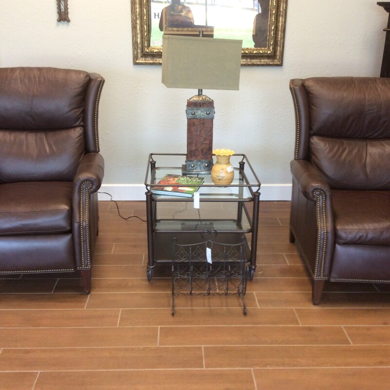 This pair of  Motioncraft Recliners are upholstered in brown leather with nail head trim.