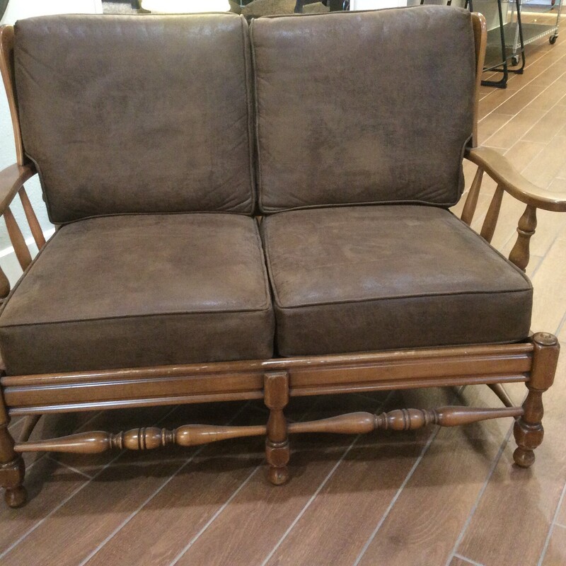 This Antique early American style Loveseat is made of maple and has removable cushions.