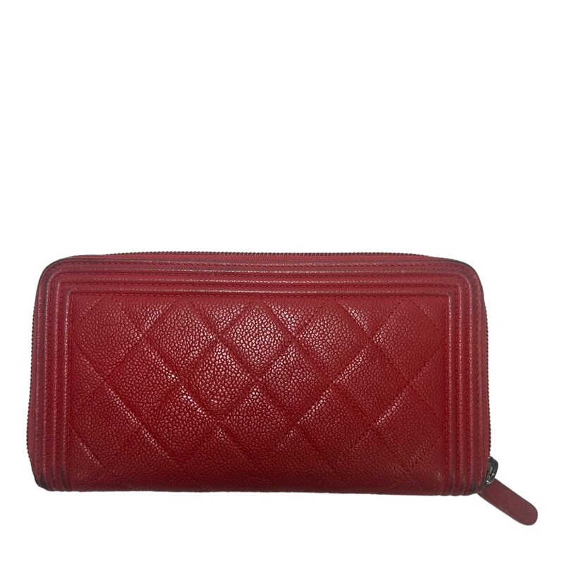 Chanel Boy Caviar Zip, Red, Size: OS<br />
<br />
Wear on all corners of the wallet and on zipper pull.<br />
<br />
Date Code: 22567108<br />
<br />
Dimensions:<br />
<br />
Base length: 7.5 in<br />
<br />
Width: 1 in<br />
<br />
Height: 4.25 in