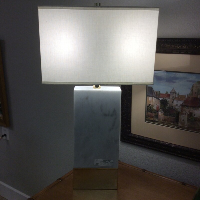 This lovely lamp is cool and chic! It features a white alabaster base making it solid and heavy with a white shade. Add a little glamour to your room with this one!Size: 31
