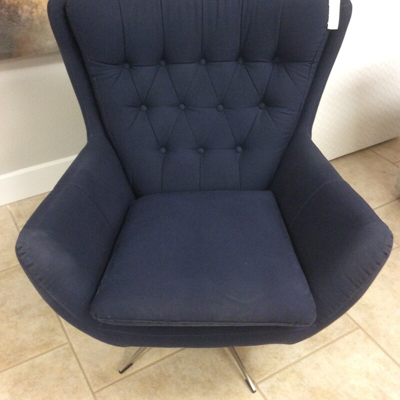 Traditional button tufting is a classicas it gets.  This modified wingback swivel chair is comfy and enveloping.