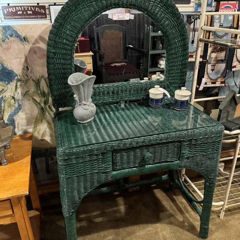 Green Wicker Vanity W/Mirror
Has a Glass Top
31 Inches Wide, 18 Inches Deep, 55 Inches High to Top of Mirror