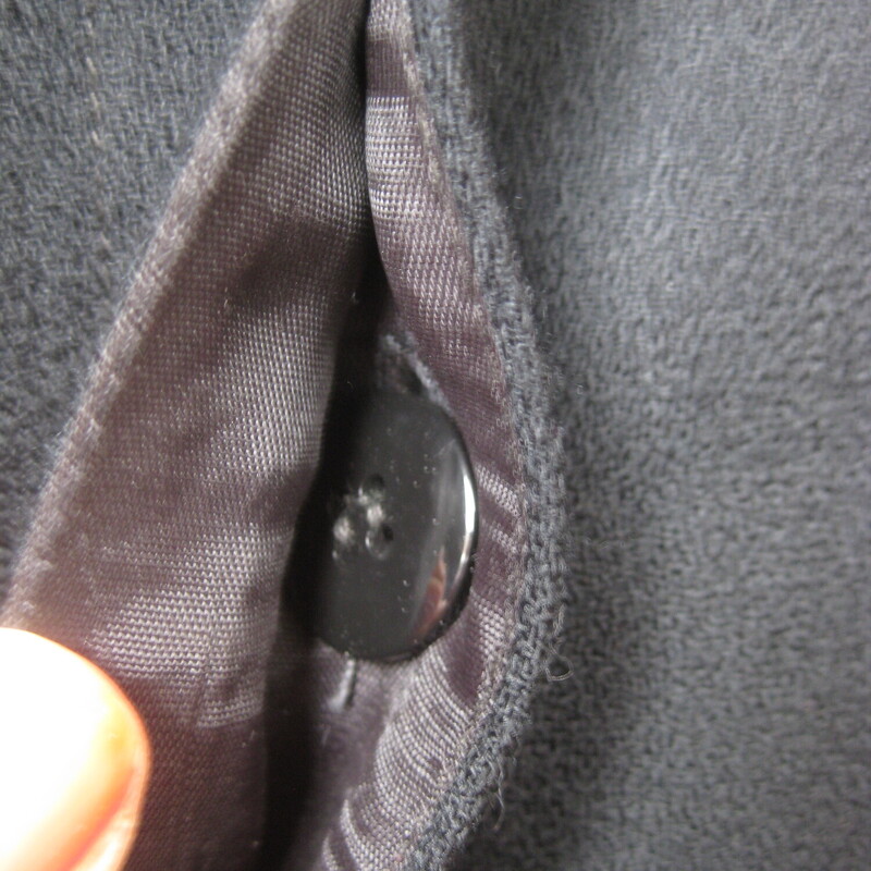 Stunning Christian Dior Blazer in black wool<br />
This blazer is a bit long as was the style in its day.<br />
Such clean lines and beautiful tailoring.<br />
One button at the neck and the rest are hidden in the placket.<br />
Fully lined in black.<br />
When I got it it has a rip in the lining at each shoulder area. I had it repaired, you can see the repairs in my last photo.<br />
Marked size 6<br />
shoulder to shoulder: 16.5<br />
armpit to armpit: 19.75<br />
waist: 17<br />
underarm sleeve seam: 16.75<br />
length: 32<br />
<br />
thanks for looking!<br />
#72706