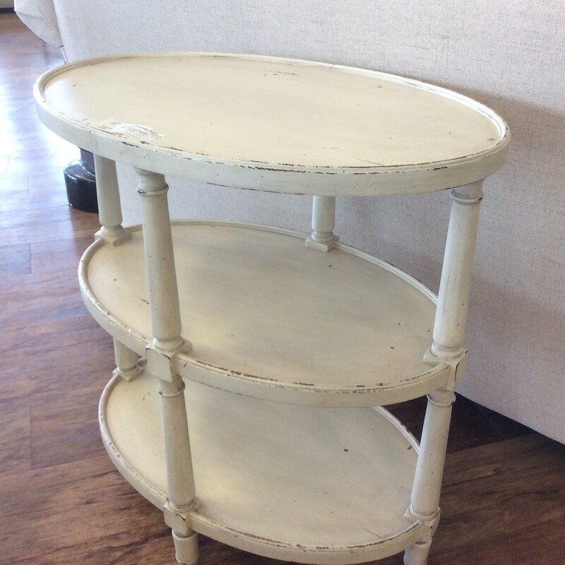 This charming oval side table by EthanAllen has an off white distressed finish,
