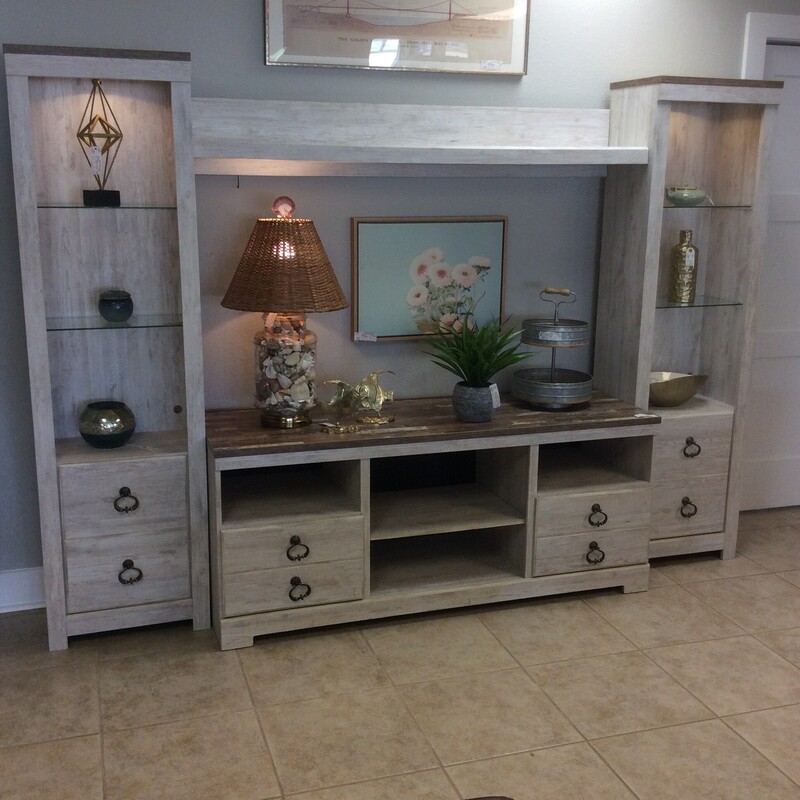 This stylish 4 piece entertainment center has a white washed wood finish and 2 lighted cabinets.