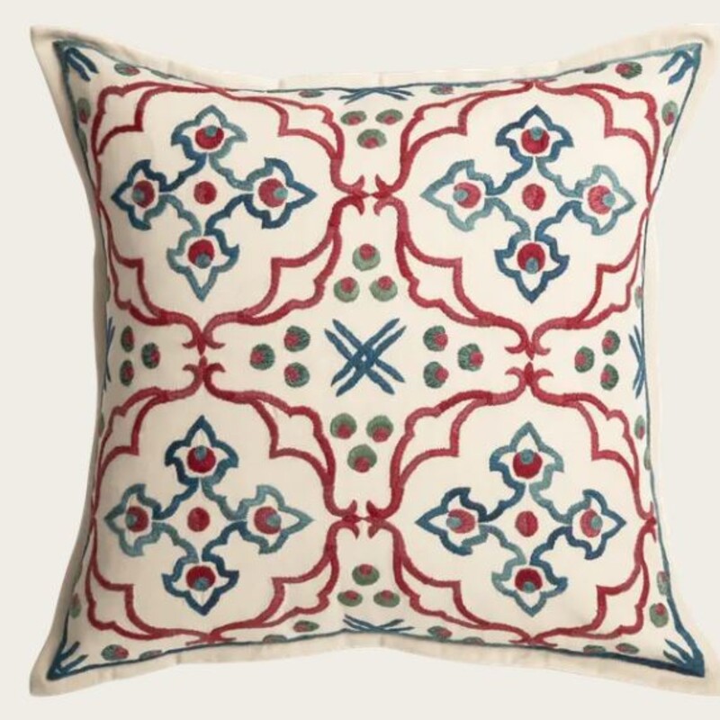 Chelsea Textiles Mitra Down Embroidered Pillow
Cream Red Blue Size: 18 x 18H
Retails: $289+
55% Linen
45% Cotton
Embroidery 100% Cotton
The enduring motif of the Cintamani - three discs positioned above wavy lines - is at the heart of this glorious medallion design,
reminiscent of Ottoman tiles. Two companion fabrics add to the versatility of its use.

Embroidered by hand