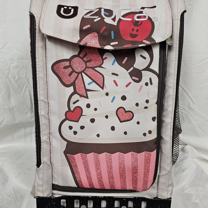 Zuca Figure Skating Bag, Black frame with Sprinklez/ Cupcake Cover, Standard Rolling, Pre-owned. Includes matching name tag but has been previously used and name has been stratched off.