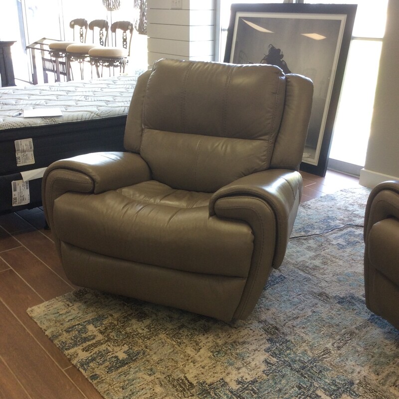 This is a luscious reclining chair by Flexsteel. Upholstered in a tan leather that is soft and supple. There is a matching sofa priced separately.