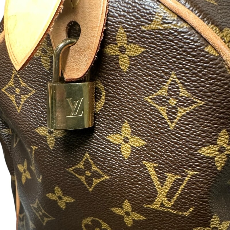 Louis Vuitton Speedy 35
Monogram Printed Coated Canvas
Comes with Louis Vuitton dust bag
Comes with lock, but no key

Production Year: 2008
Date Code: SD0058

Dimensions:
Height 9 inches
Width 14 inches
Depth 7.25 inches
Handle Drop Length 4 inches