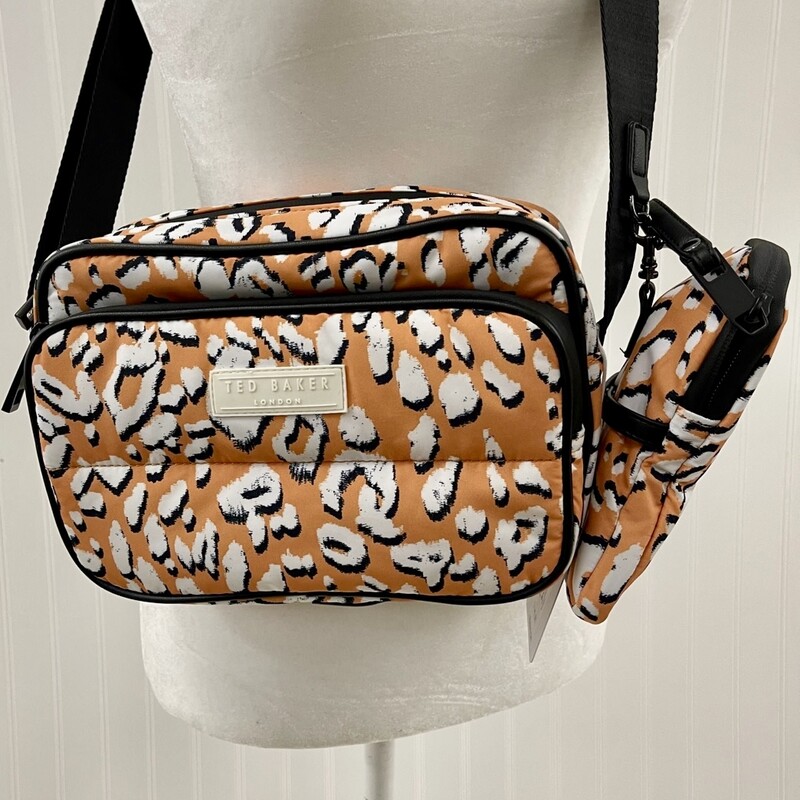 TED BAKER
NWT Ted Baker Women's Niqita Leopard Detail Puffer Nylon Camera Bag
Cut from recycled shell in a vibrant orange white and black leopard print, it adds a playful pop of colour to your look. The cushioned silhouette has multiple zipped pockets – including a removable pouch - for effortless organisation.
Main/Lining: Recycled Polyester. Trim: Faux Leather.
Dimensions: H: 16cm x W: 23cm x D: 8cm. Strap Drop: 55cm.
NO marks or flaws.  New Condition!
Retail Price:  $145.00