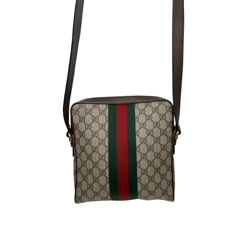 Gucci  Ophidia
Beige/ebony GG Supreme canvas, with brown leather trim
Green and red Web
Antique gold-toned hardware
Interior open pocket
Double G
Front zipper pocket
Interior zipper pocket
Adjustable leather shoulder strap with 21.5 drop
Zipper closure
Small size: 9W x 9.5H x 2D
Made in Italy