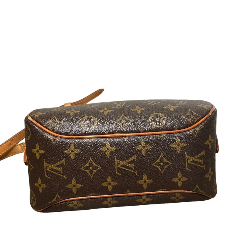 LOUIS VUITTON Monogram Blois. This stylish crossbody is crafted of traditional Louis Vuitton monogram on toile coated canvas in a feminine oval silhouette. The shoulder bag features a lengthy vachetta cowhide leather shoulder strap with brass hardware and a full wide facing pocket with a vachetta trim. The top zipper opens to a spacious terra-cotta cross-grained leather interior with a patch pocket.<br />
Dimensions:<br />
Length: 9.5 in<br />
Height: 7 in<br />
Width: 4.5 in<br />
Drop: 16 in