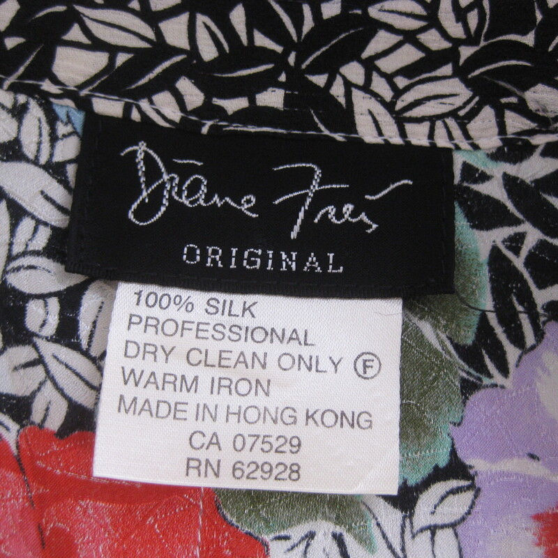 Rare find!  Diane Freis silk kimono with matching black silk trousers.<br />
The kimono is a floral print with a contrasting black and white printed trim<br />
It has no closures.<br />
Very fluid and it has a deep inverted pleat in the center back.<br />
The sleeves ends have stitched on elastic but the elastic is totally shot with age.  that said you can still push the sleeves up over the elbow and they will stay up.<br />
The pants have pleats in the front, they're done in black jacquard.  They have pockets.<br />
They have an elastic waist but the elastic on these is shot as well.  Easy to have replaced if desired, priced accordingly.<br />
Flat measurements:<br />
kimono:<br />
armpit to armpit: 24<br />
length: 29<br />
pants:<br />
waist: 200.25<br />
rise: 15.5<br />
hip: 33<br />
inseam: 30.25<br />
leg opening at the hem: 12<br />
<br />
thanks for looking!<br />
#72247