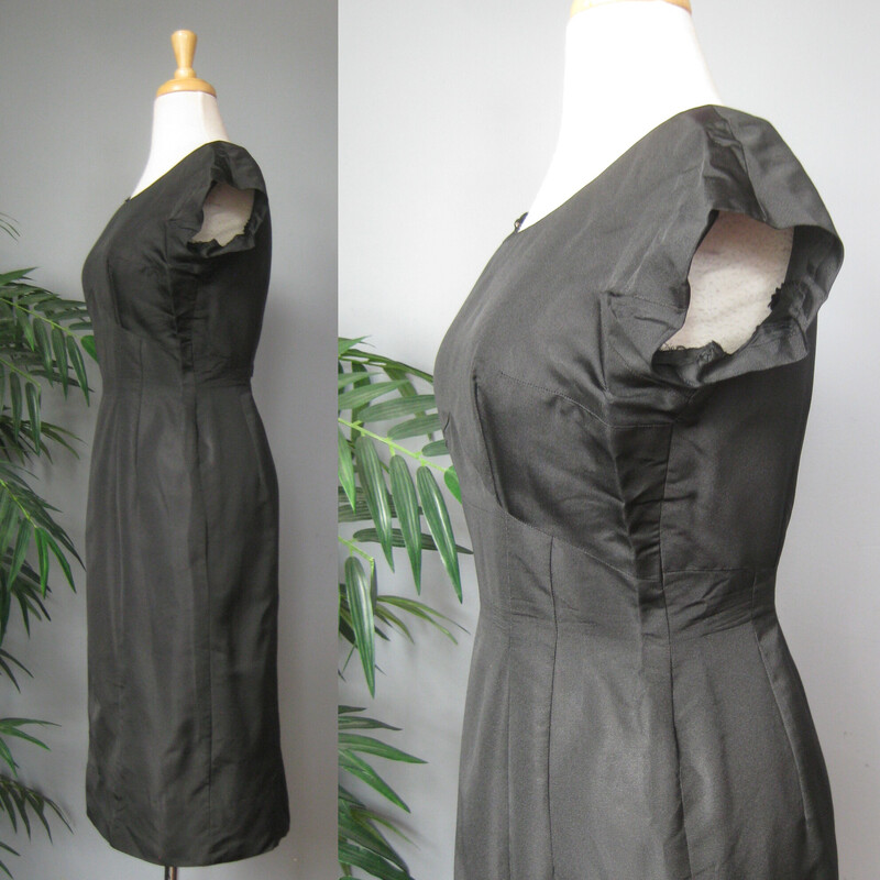 Simple black silk sheath dress from the 1950s<br />
No tags.<br />
unlined<br />
Center back metal zipper<br />
Perfect wardrobe builder, this classic little black dress will easily take you from work to evening to weekend by changing up the shoes and jewelry..<br />
<br />
NO size tags, fits my size 4 mannequin well.<br />
Pls use flat measurements below:<br />
Armpit to Armpit: 18.5<br />
Waist: 14<br />
Hips: 19<br />
Overall Length: 40<br />
<br />
Thank you for looking<br />
#70431