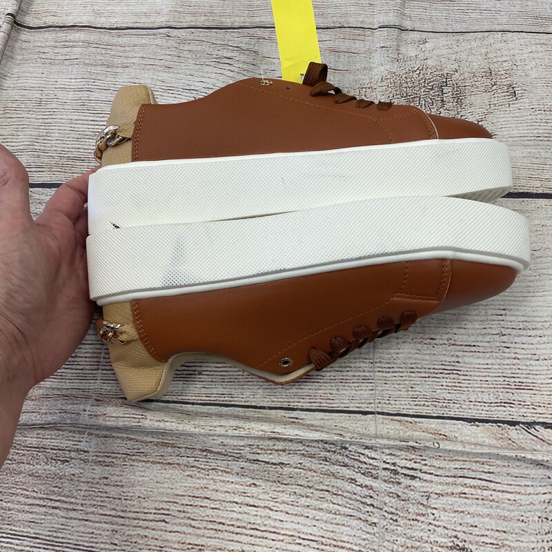 sandle tan and white shoes has gold chain on the back of the heal. size 9/9.5