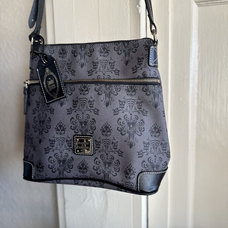 Dooney&Bourke Cross Body -Haunted Mansion, Size: LIMITED-EDITION<br />
<br />
New Condition on this Collector's Limited Edition Haunted Mansion Dooney & Bourke<br />
<br />
ALL Sales are Final. No Returns<br />
<br />
Pick Up In Store Or Have it Shipped<br />
<br />
Thank You For Shopping With Us:-)