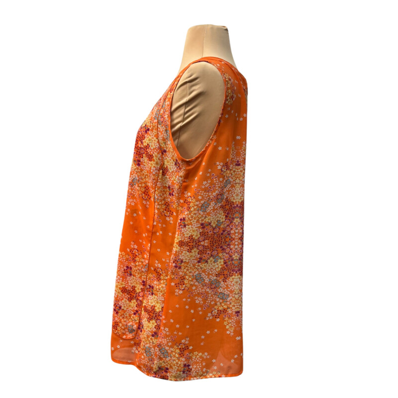 CAbi Merrow Edge Floral Blouse<br />
Lined in the Front<br />
Color:  Orange with Aqua, Purple and Yellow<br />
Size: Medium