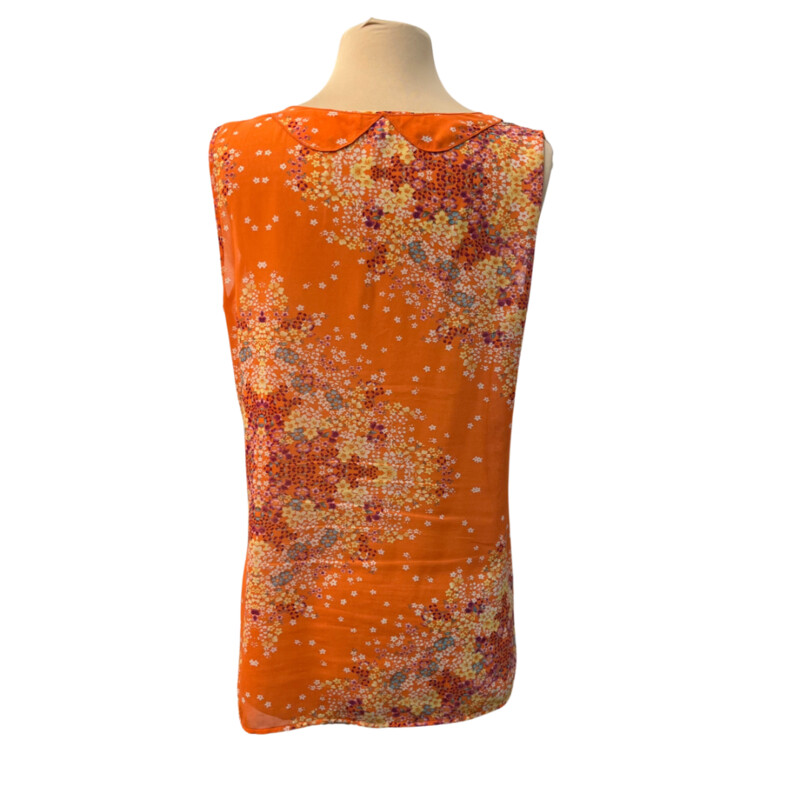 CAbi Merrow Edge Floral Blouse
Lined in the Front
Color:  Orange with Aqua, Purple and Yellow
Size: Medium