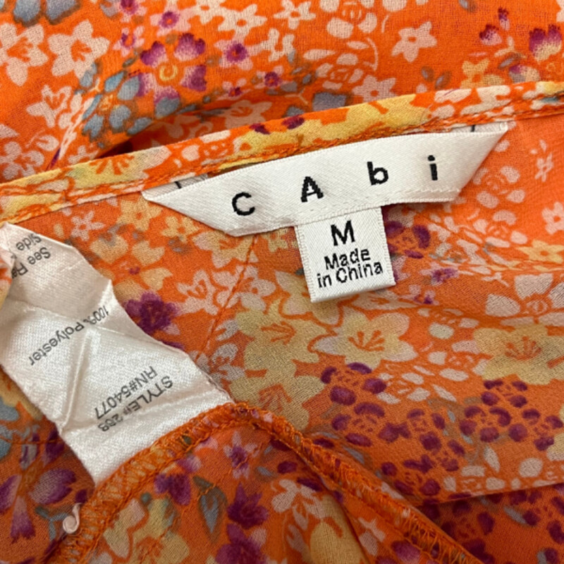 CAbi Merrow Edge Floral Blouse
Lined in the Front
Color:  Orange with Aqua, Purple and Yellow
Size: Medium