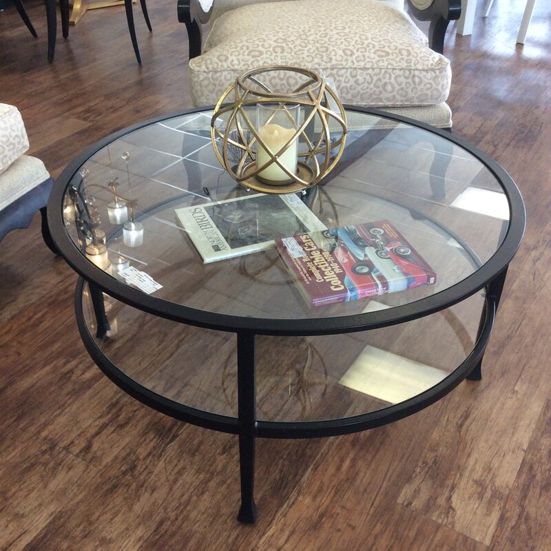 Round Iron frame with glass top and shelf coffee table.  Size: 36