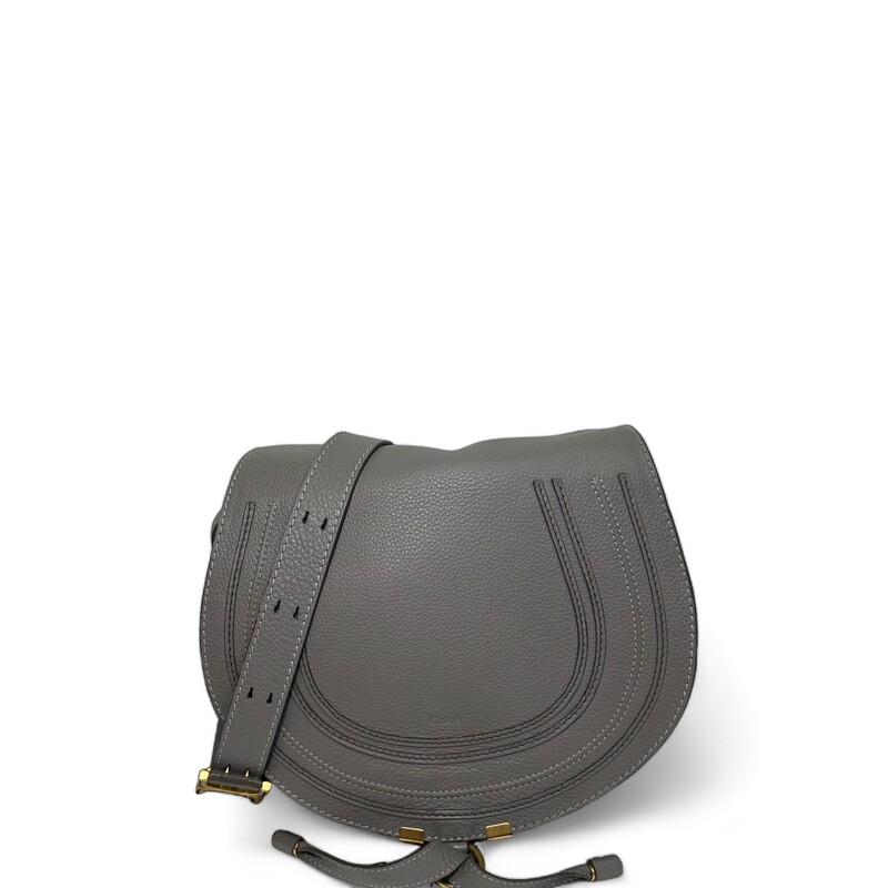 Chloe Marcie Crossbody

Curvaceous detailing and golden hardware ornament the saddle-shaped flap of a crossbody bag crafted from sumptuous grained leather in a spacious silhouette.

Magnetic-snap flap closure
Adjustable crossbody strap
Interior wall pocket; slip pocket beneath flap
Structured silhouette with flat base for stability
Linen lining
Leather
Made in Italy

Dimensions:
Base length: 11 in
Height: 10 in
Width: 4 in
Drop: 17 in