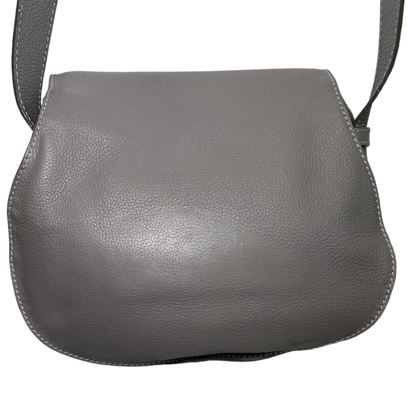 Chloe Marcie Crossbody<br />
<br />
Curvaceous detailing and golden hardware ornament the saddle-shaped flap of a crossbody bag crafted from sumptuous grained leather in a spacious silhouette.<br />
<br />
Magnetic-snap flap closure<br />
Adjustable crossbody strap<br />
Interior wall pocket; slip pocket beneath flap<br />
Structured silhouette with flat base for stability<br />
Linen lining<br />
Leather<br />
Made in Italy<br />
<br />
Dimensions:<br />
Base length: 11 in<br />
Height: 10 in<br />
Width: 4 in<br />
Drop: 17 in